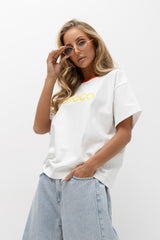 T-SHIRT BOPOCO BIAŁY Z POMARAŃCZOWĄ LAMÓWKĄ image 1